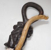An African carved wood walking cane and a ‘dogs head’ walking cane
