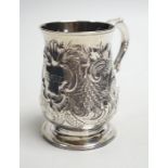 A George III silver baluster mug, with later embossed decoration, John King, London, 1775, height
