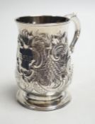 A George III silver baluster mug, with later embossed decoration, John King, London, 1775, height