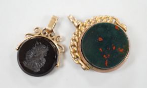 A late Victorian 9ct gold and bloodstone set spinning fob seal, 29mm and one other yellow metal