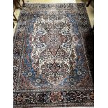 An antique Kashan blue ground rug, 207 x 140cm
