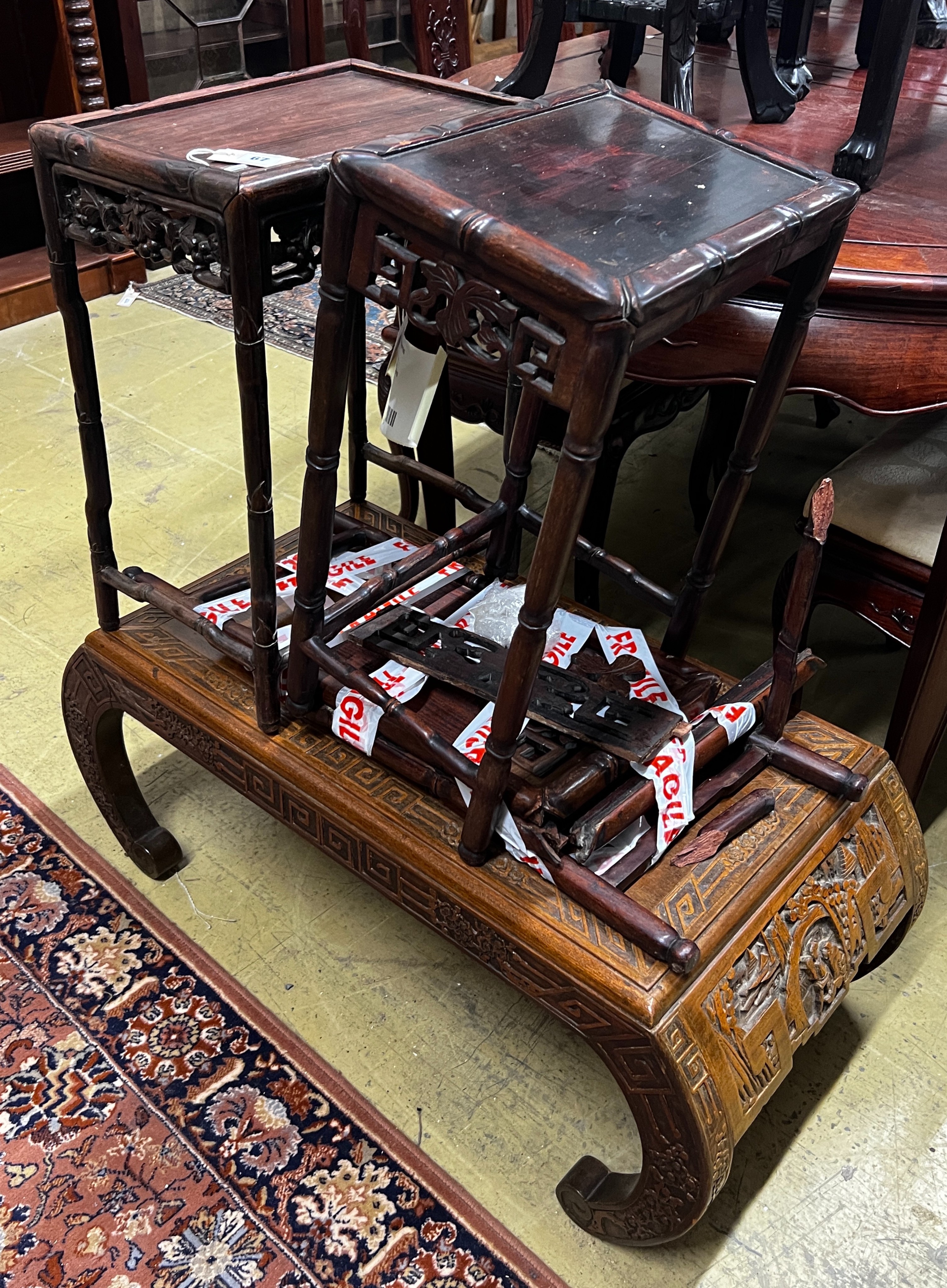 A Chinese carved hardwood low table, length 89cm, depth 43cm, height 36cm together with three