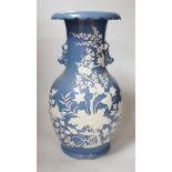 A Chinese slip-decorated blue glazed vase, 40cm