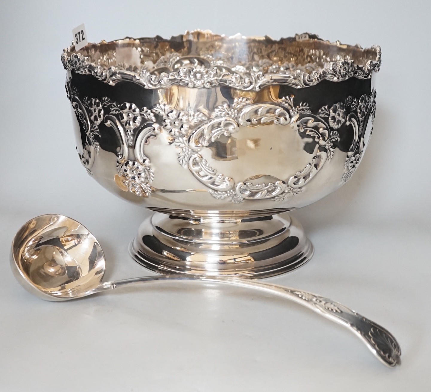 A Sheffield plated punch bowl and a plated soup ladle, bowl 30cms diameter