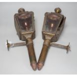 A pair of Victorian coaching lamps, converted to electricity, 51cm high