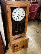 A vintage Gledhill-Brook oak cased clocking in machine, height 106cm