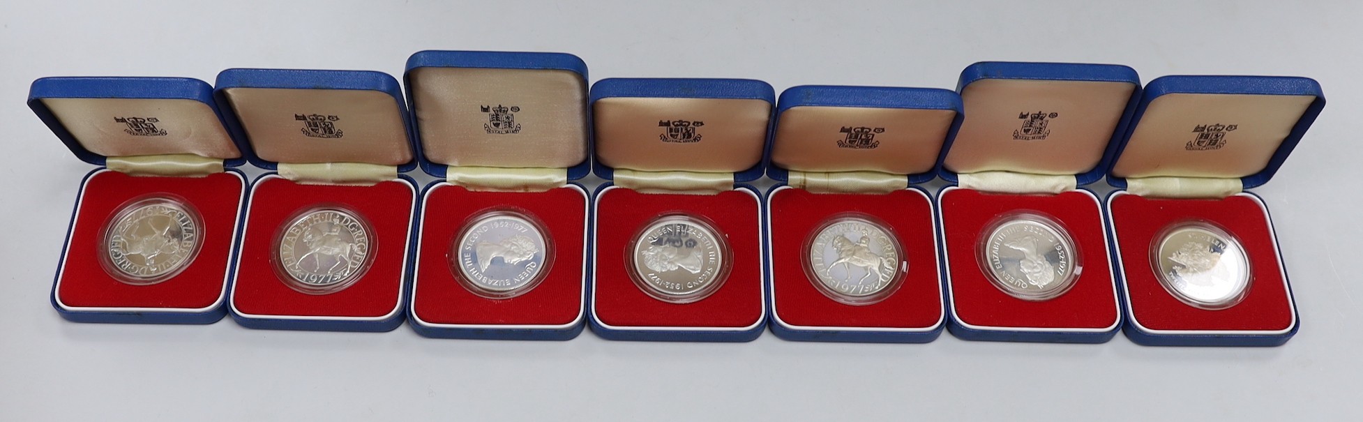 Royal Mint proof silver coins - three QEII UK Silver Jubilee crowns and four Commonwealth crowns (