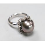 A modern Italian 750 white metal, cultured pearl and diamond chip set dress ring, with