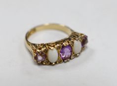 A modern 9ct gold, three stone amethyst and two stone white opal set half hoop ring, with white