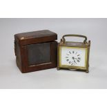 A lacquered brass carriage clock, 12cm wide, cased