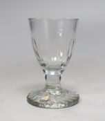 A Georgian moulded toasting glass. 9cm tall