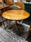 A George III circular oak tilt top tripod tea table, diameter 80cm, height 75cm