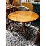 A George III circular oak tilt top tripod tea table, diameter 80cm, height 75cm