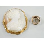 A pinchbeck mounted oval cameo shell brooch, 64mm and a gold plated watch ring.