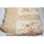 A 19th century Arts and Crafts bedcover; embroidered on linen in panels with crochet edges and