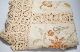 A 19th century Arts and Crafts bedcover; embroidered on linen in panels with crochet edges and