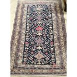 A Caucasian blue ground rug, 180 x 115cm