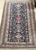 A Caucasian blue ground rug, 180 x 115cm