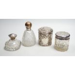 Two repousse silver lidded toilet jars, including glass, largest, 95mm and two silver mounted