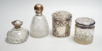 Two repousse silver lidded toilet jars, including glass, largest, 95mm and two silver mounted