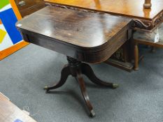 A Regency inlaid rosewood D shaped folding card table, width 86cm, depth 44cm, height 74cm