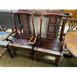 A pair of Chinese elm elbow chairs, width 63cm, depth 50cm, height 118cm