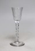 A George III facet stem wine or cordial glass, wheel engraved flowers. 16.5cm tall