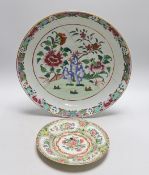 An 18th century Chinese famille rose charger and a Canton plate, charger 36cms