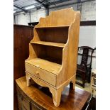A small 19th centurty pine graduated open bookcase, length 49cm, depth 35cm, height 90cm