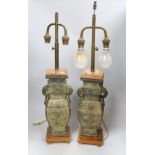 A pair of archaic Chinese bronze vases, converted into table lamps, 62cms high including light