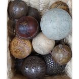 A collection of leather cricket and sporting balls