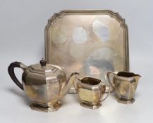 A George VI silver three piece tea set and matching tea tray, E.J.E, Sheffield, 1939, tray with