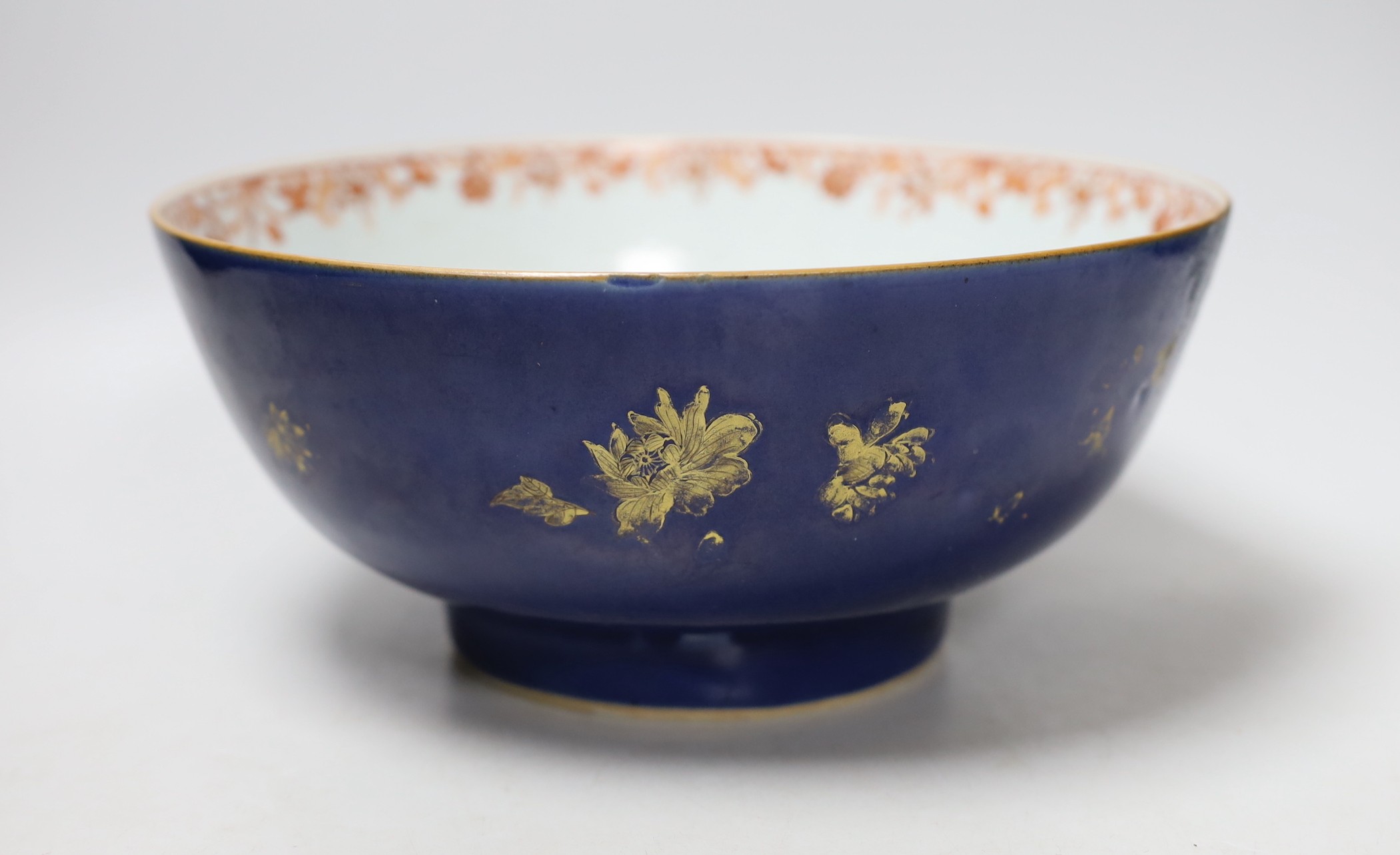 An 18th century Chinese gilt decorated powder blue glazed bowl, 26cm diameter