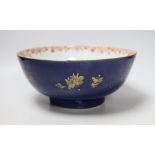 An 18th century Chinese gilt decorated powder blue glazed bowl, 26cm diameter