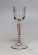 A Dutch red and white colour twist stem cordial glass, 13cms high