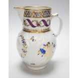 An 18th century Caughley very rare polychrome mask jug, elaboratley painted and gilded with two