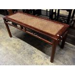 A Chinese caned hardwood rectangular low table, length 110cm, depth 38cm, height 48cm