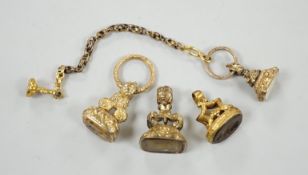 Four assorted 19th century gold plated fob seals, set with citrine, glass or carnelian, largest