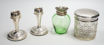 A pair of mid 20th century silver mounted dwarf candlesticks, 92mm, a silver mounted glass jar and a