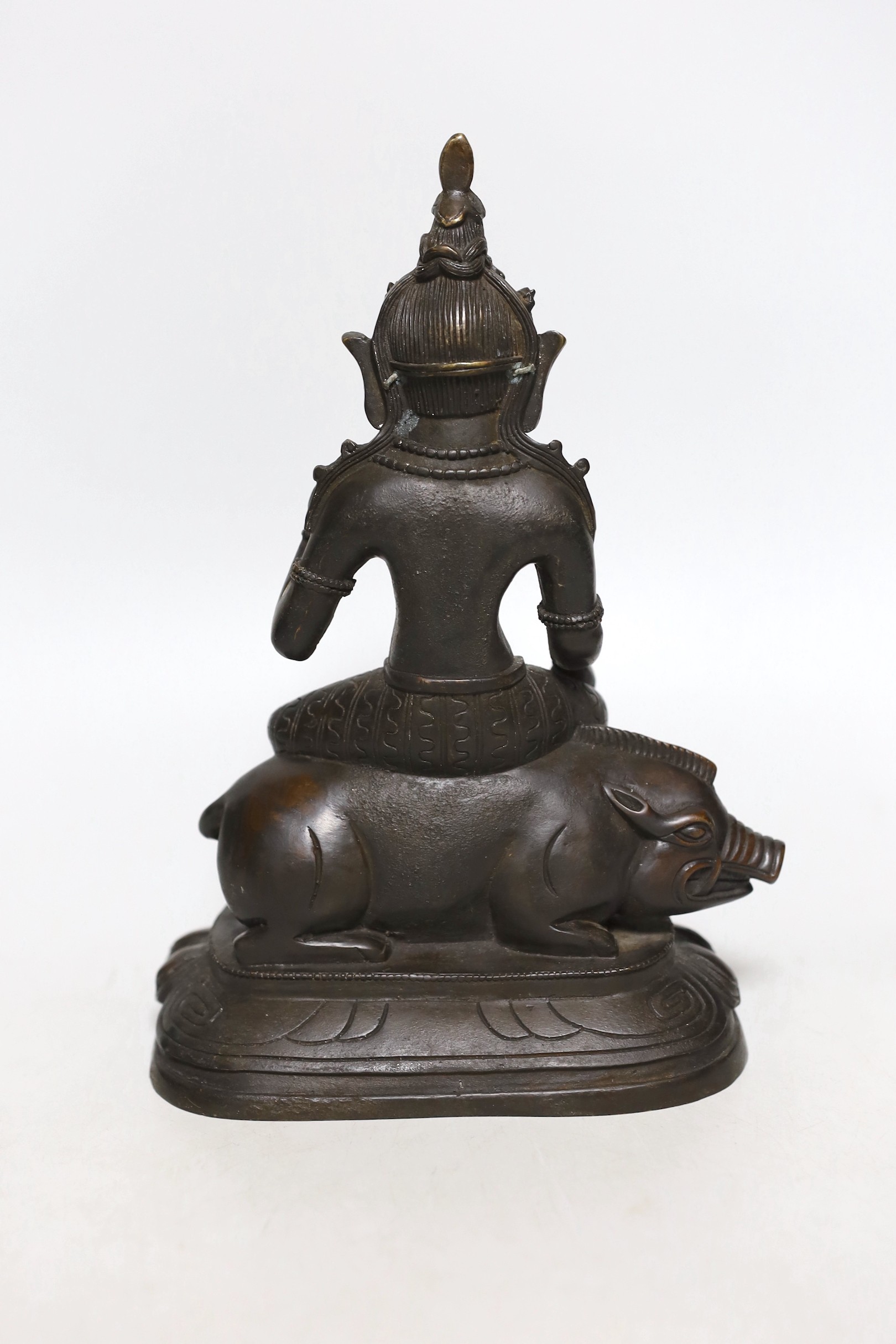 A buddhist bronze figure of Marici seated on a boar, 26cms high - Image 2 of 3