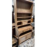 An Arts & Crafts pitch pine dresser with secretaire drawer, length 92cm, depth 41cm, height 220cm