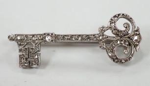 An early 20th century white metal and rose cut diamond set 'key of the door' brooch, 33mm, gross