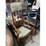 An Edwardian inlaid mahogany elbow chair, width 63cm, depth 44cm, height 122cm