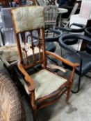 An Edwardian inlaid mahogany elbow chair, width 63cm, depth 44cm, height 122cm