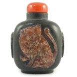 A Chinese two colour marble cameo ‘tiger’ snuff bottle, 19th century, of flattened oblong form,