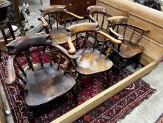 A harlequin set of five Victorian elm and beech smoker's bow chairs