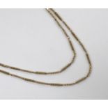 A 19th century twin strand yellow metal box and oval link chain, 70cm, 20.3 grams.