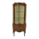 An early 20th century French ormolu mounted kingwood and parquetry vitrine, of serpentine bombé