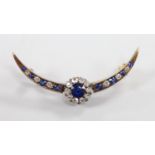 A Victorian yellow metal, sapphire and diamond cluster set crescent brooch, 42mm, gross weight 3.9