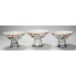 Three 19th century Chinese famille rose pedestal stem bowls, each painted with flowers and